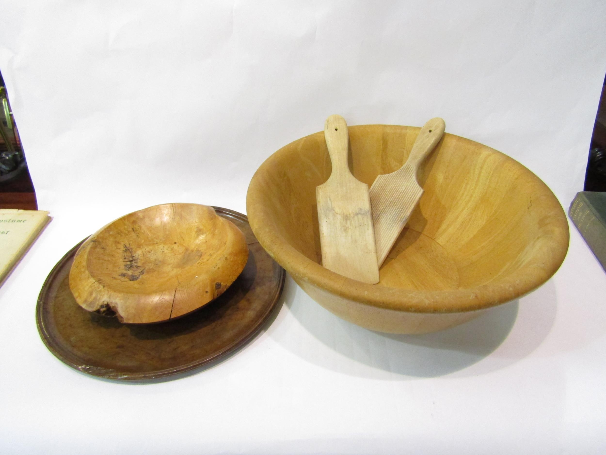 Five wooden items including fruit bowl, butter pats and a dish