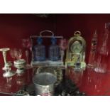 A Betjeman's Patent tantalus (no key), glassware, clock and plated items