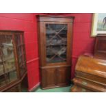 A mahogany full height corner cabinet with working locks and key. 199cm high x 99cm wide