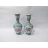 A pair of Victorian Meissen porcelain vases decorated with flowers and cherubs, 24.5cm high