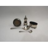A silver table salt, pepperette, sugar spoon and a miniature photograph frame (4)
