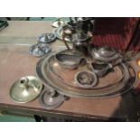 A selection of plated wares including part tea set, wine bottle coaster, chamber sticks, oval tray