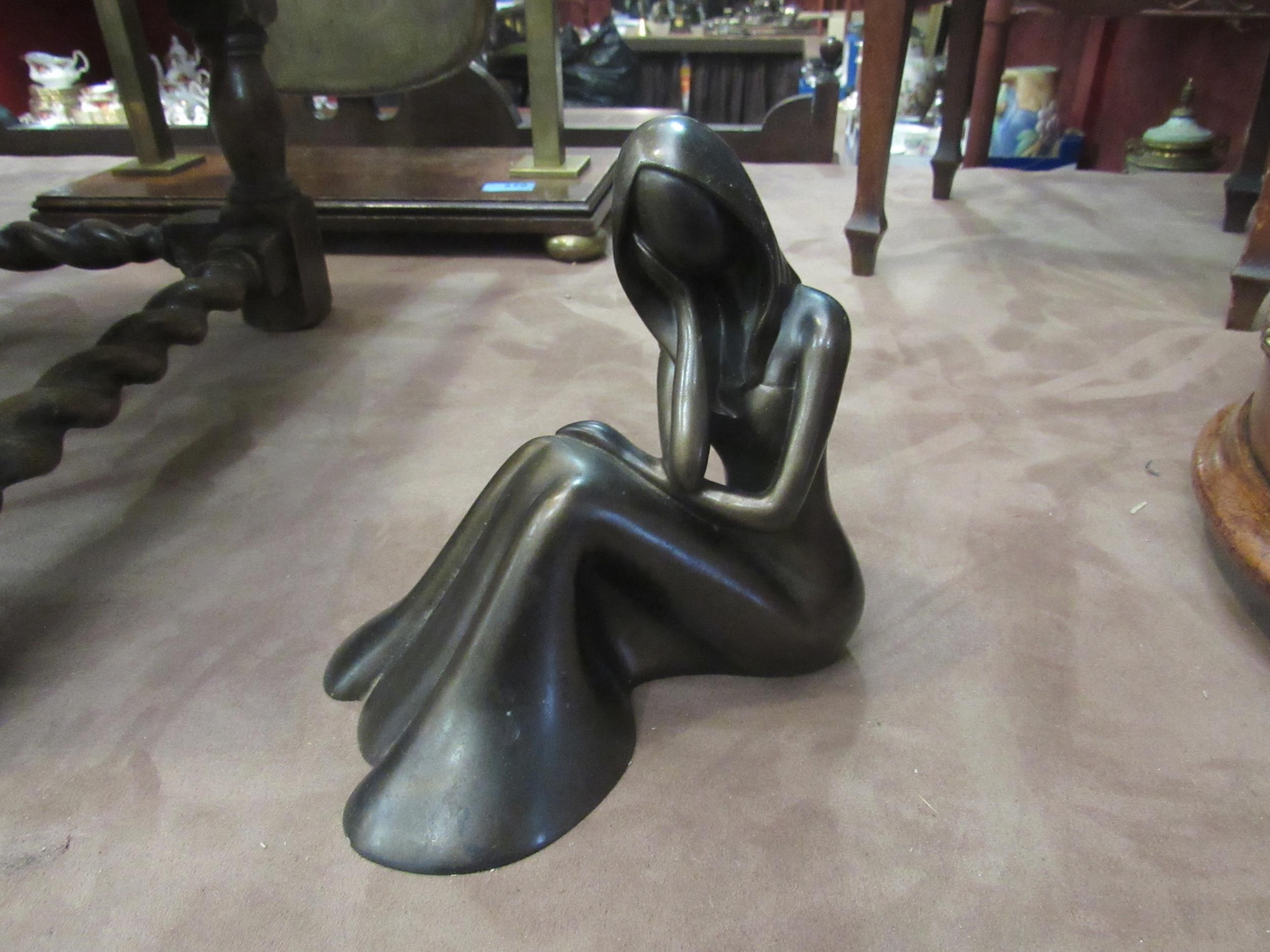 A bronzed effect model of a pondering female, 17cm high