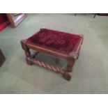 An oak footstool with barleytwist stretchers, velveteen fabric upholstery