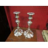 A pair of ornate Sheffield plate candlesticks, 26cm high