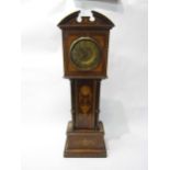 A late 19th/early 20th Century miniature longcase clock movement a/f, 51cm high, 17cm wide