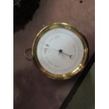 A brass cased travelling barometer