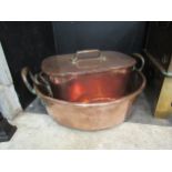 A heavy copper maslin jam pan 40.5cm diameter and another large lidded pan stamped A.P. to pan and