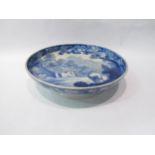 A Victorian blue and white transfer printed pottery cake stand depicting a cow, cottage and