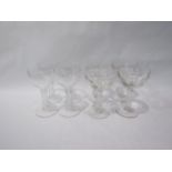 Two sets of four antique champagne glasses, one set hollow stemmed