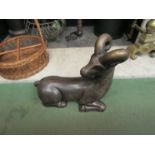 A painted terracotta hollow figure of a goat with bronzed finish, Deco in style, restoration to