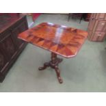 A Victorian carved walnut tilt-top table with canted rosewood and fruitwood top, 69cm high x 67cm