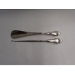Two silver handled items, shoe horn and button hook