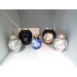 A group of five small porcelain vases including Royal Doulton