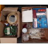 Two boxes of miscellaneous metal ware and collectibles including car badges, collectors spoons and