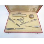 A cased manicure set, 2 pieces stamped 800. One glass pot missing