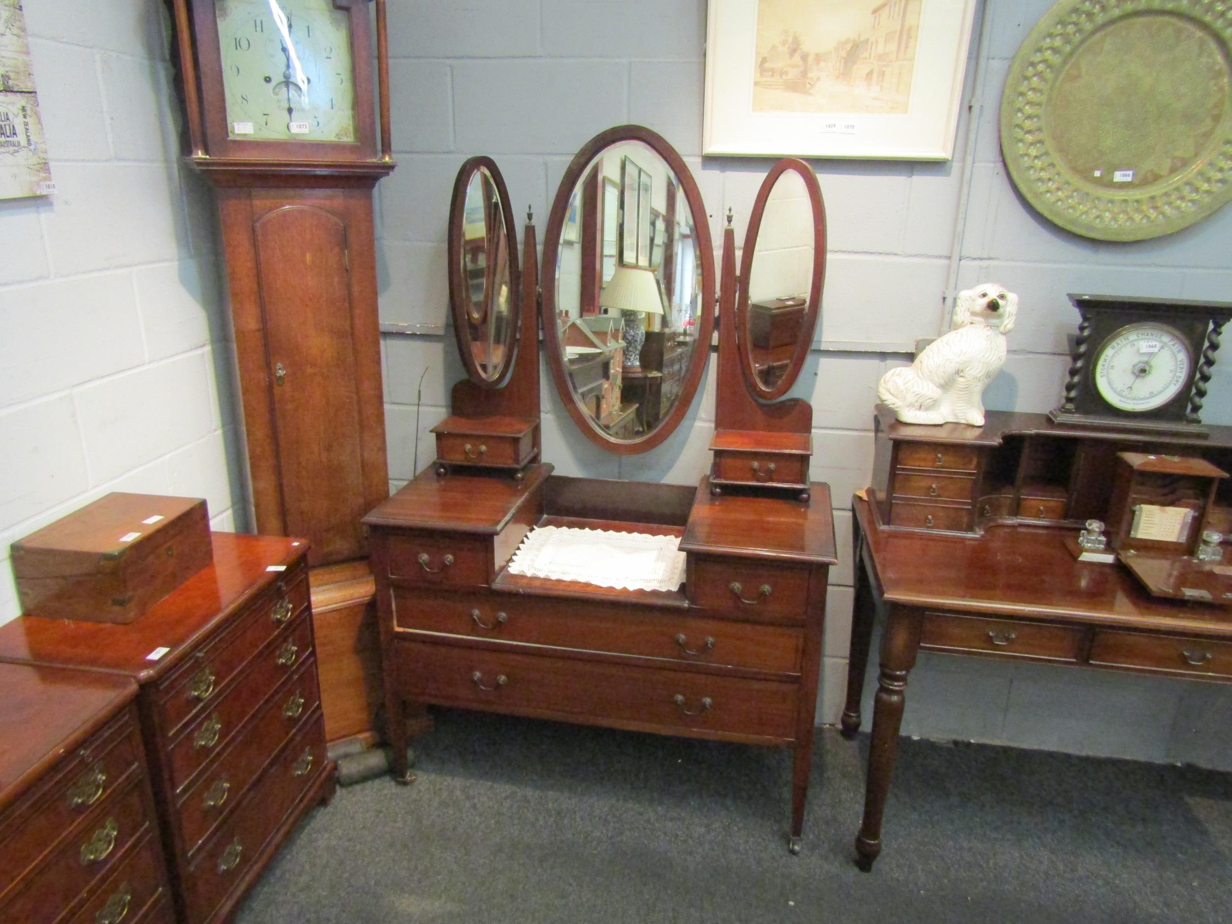 An Edwardian mahogany dressing table with triple oval mirrors. 170cm high x 111cm wide x 50cm deep