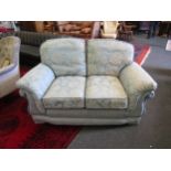 A classic style suite of furniture comprising of two three-seater sofas and a two seater sofa,
