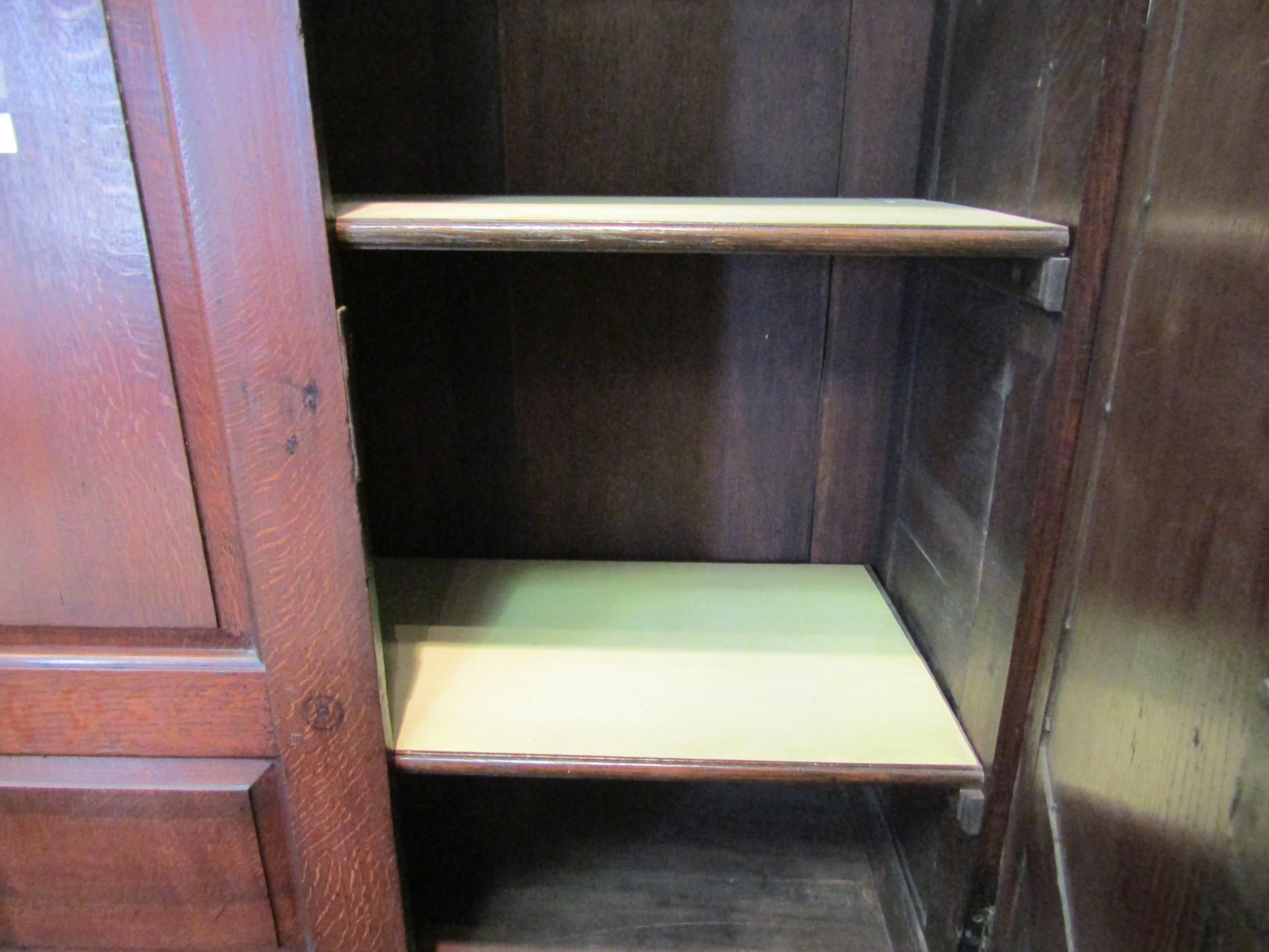 An early to mid 18th Century oak slim two door cupboard over two over two drawer base with swan neck - Bild 5 aus 5
