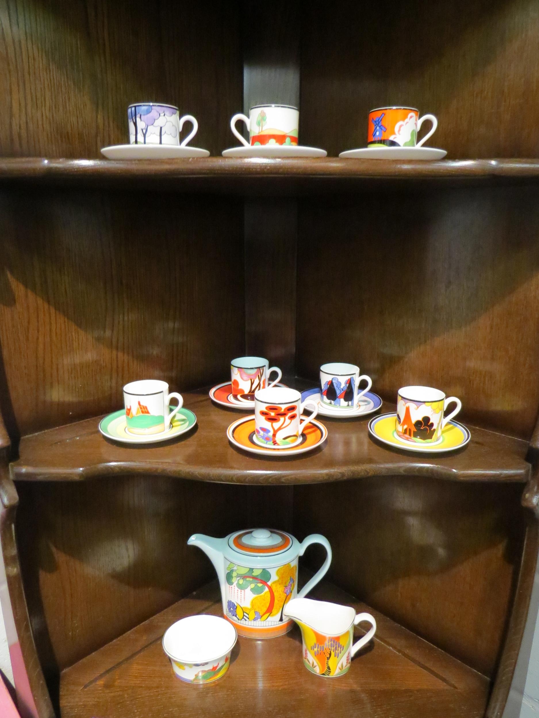 A Wedgwood Clarice Cliff harlequin coffee set consisting of coffee pot, sucrier, milk jug and