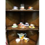 A Wedgwood Clarice Cliff harlequin coffee set consisting of coffee pot, sucrier, milk jug and