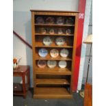 An Ercol elm full height bookcase, 197cm high x 97cm wide x 32cm deep