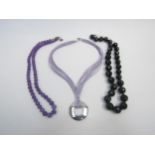 Three 925 stamped mounted necklaces including amethyst and black onyx set examples