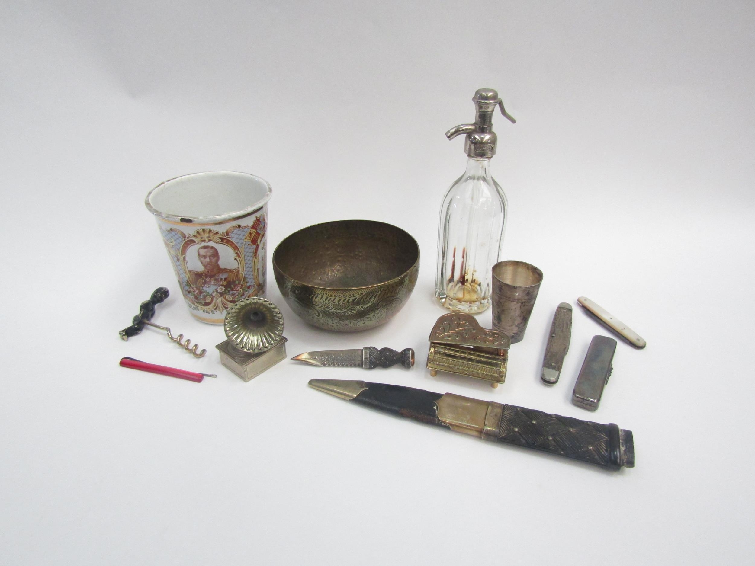 A selection of items including miniature items, penknives, corkscrew, soda siphon, Eastern brass