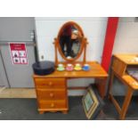 A modern pine desk with single pedestal of three drawers, 75cm high x 102cm wide x 45cm deep, with a