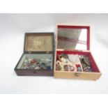 Two jewellery boxes containing costume jewellery, brooches, beaded necklaces, etc