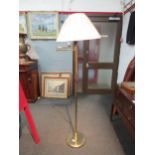 A brass swivel reading lamp with pleated shade