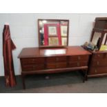 A Stag dressing table with six drawers, mirror back, 128cm high x 130cm wide x 45cm deep