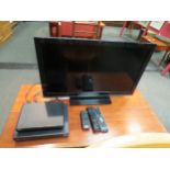 A Panasonic flat screen TV with related accessories