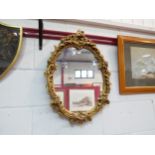A gilt plaster classical style framed wall mirror