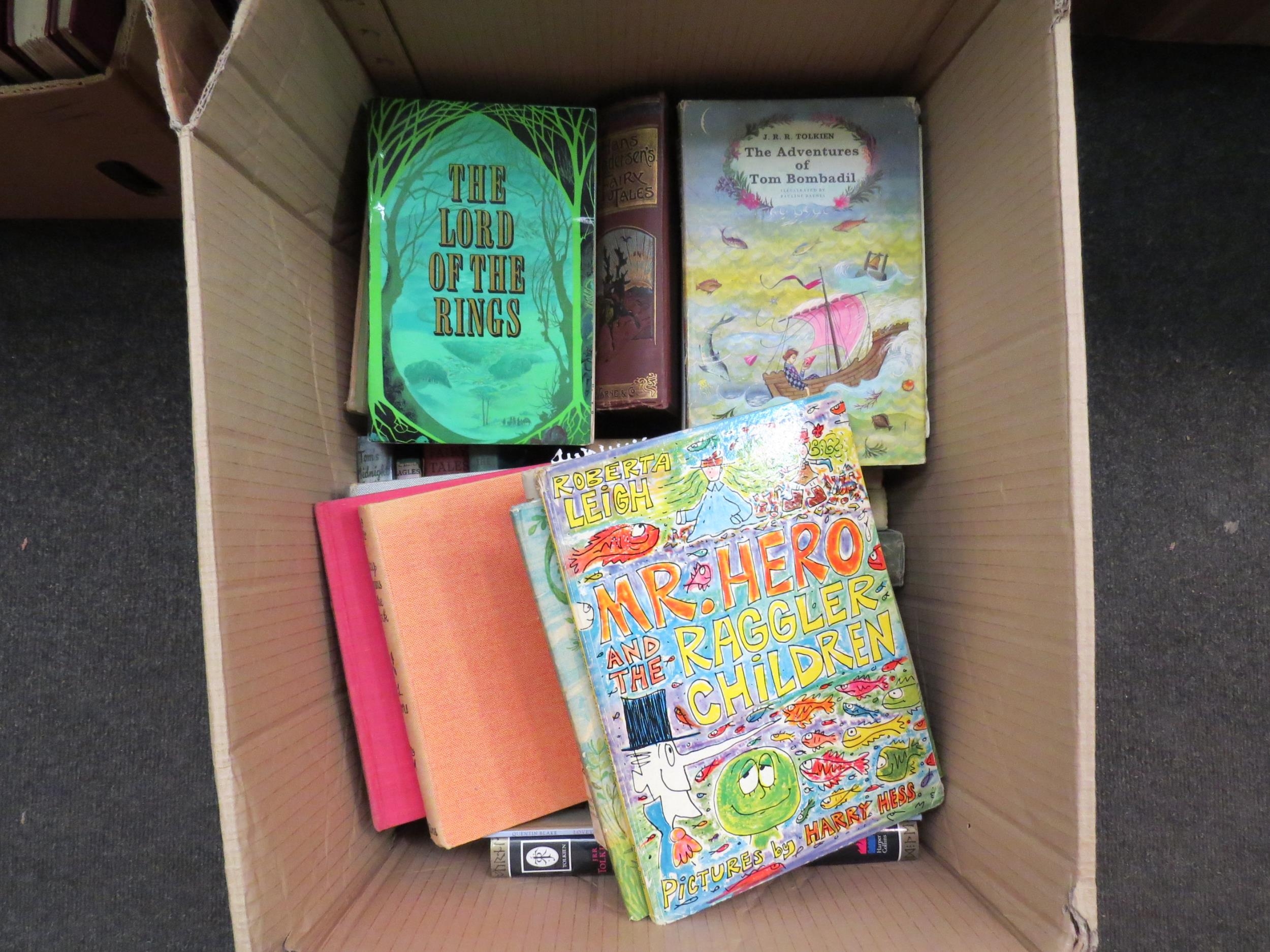 A box of children's and illustrated books, including J.RR Tolkien, Antoine de Saint Exupery,