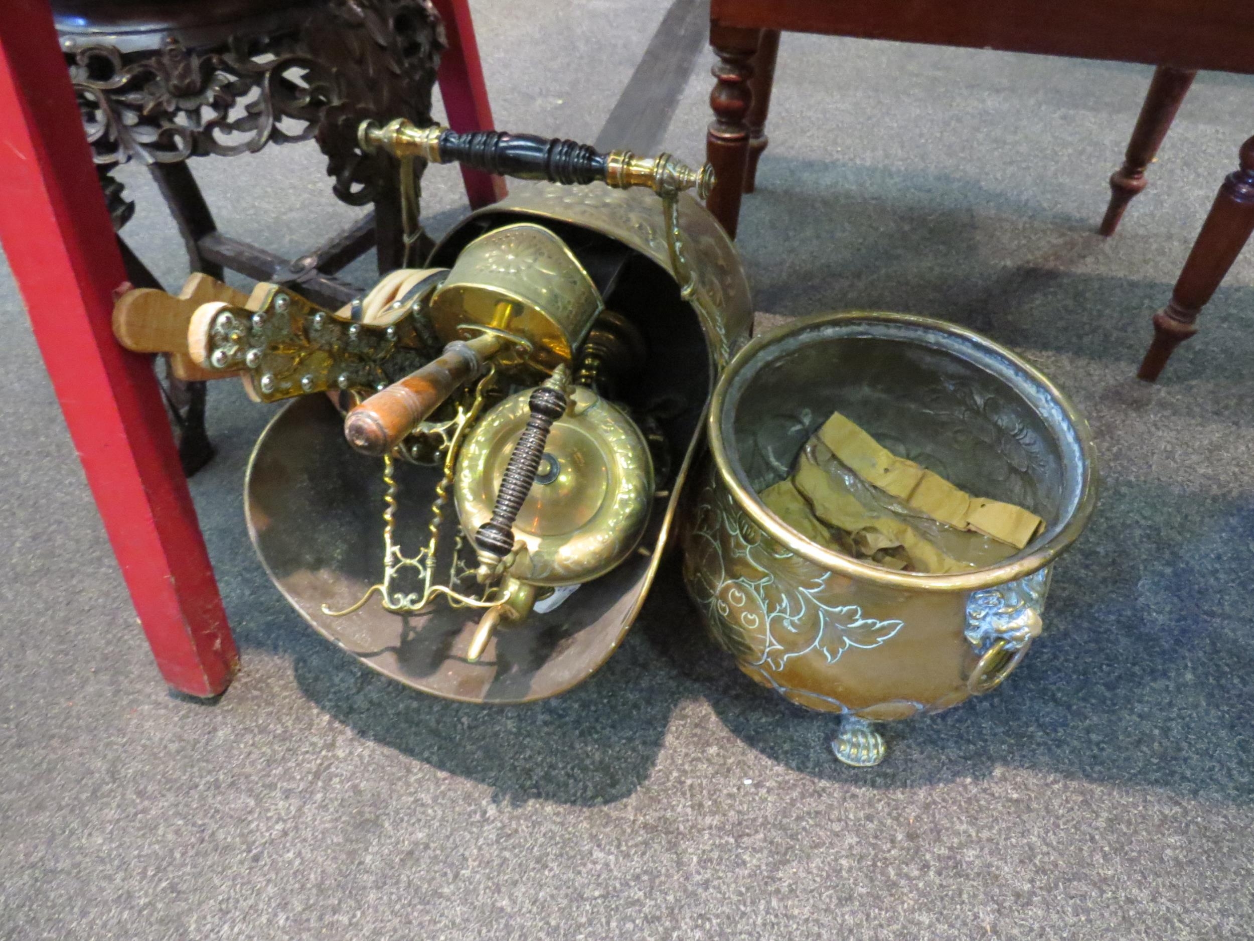 Assorted brassware including candlesticks, a coal scuttle and scoop, tea kettle on stand, etc.