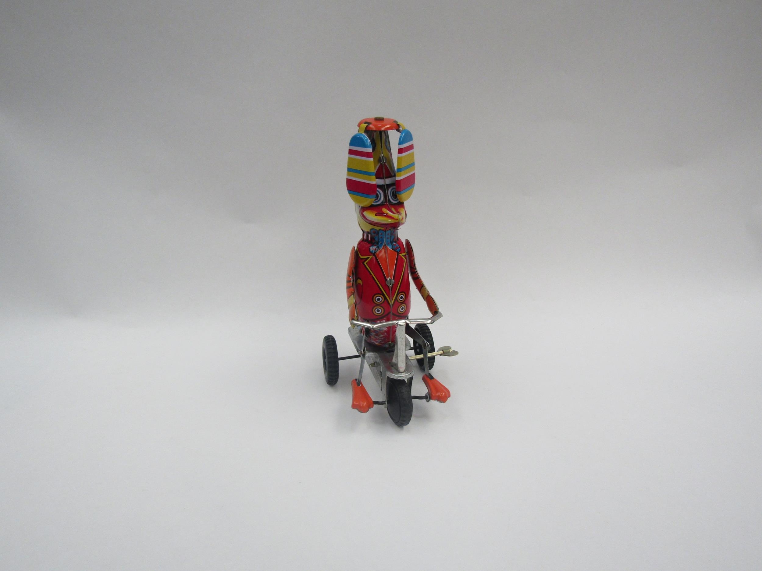 A boxed Knox and Floyd Classic Toys "Happy Wanderer" clockwork tinplate "Duck on Tricycle"