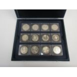 A case of twelve Westminster mint 'Lifetime of Service' coins of Queen Elizabeth II