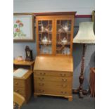 A pine dresser, two glazed cupboards over Bureau base four drawers, 210cm x 95cm x 54cm