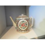 A Chinese export teapot decorated in famille rose palette depicting flowers