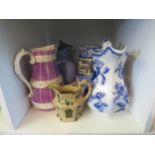 A collection of five Victorian pottery jugs
