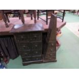 A small carved African wooden chest of eight drawers, 84cm high x 46cm wide, together with another