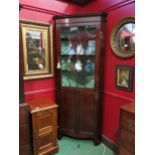 A George III line inlaid mahogany corner cabinet in the manner of "Chippendale", the astragal glazed