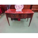 Circa 1860 a flame mahogany bow front side table, the single frieze drawer flanked by moulded panels