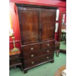 Circa 1780 a flame mahogany country house linen press the two doors with brass door bar enclosing