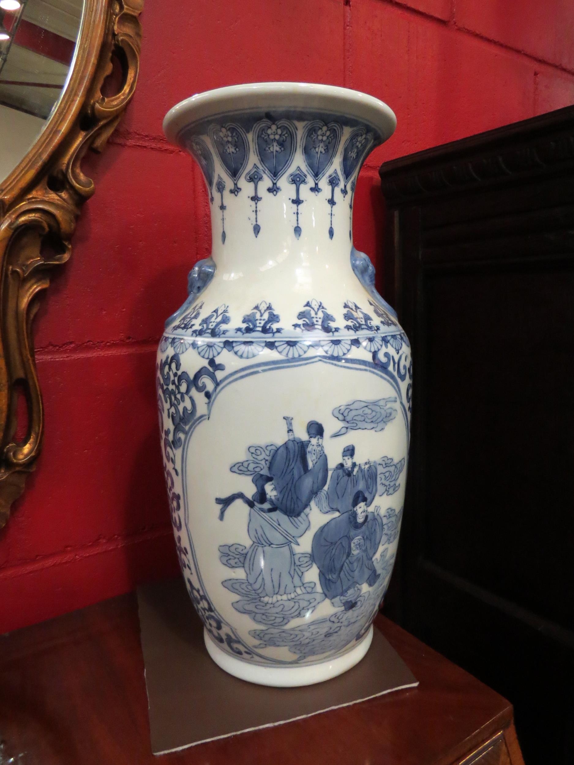 A large blue and white Oriental floor vase, 49cm high