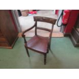 A bar-back carver chair with turned fore legs and outswept rear legs