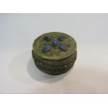 An Indian metal circular trinket box with cabochon stone top, 7.5cm diameter