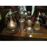 Four various Middle Eastern copper and brass water vessels