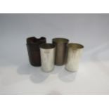 A set of three silver hunting cups in leather container, a/f
